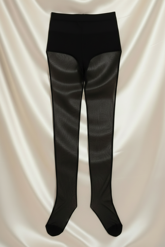Women's solid black stockings laid flat on silky cream fabric background