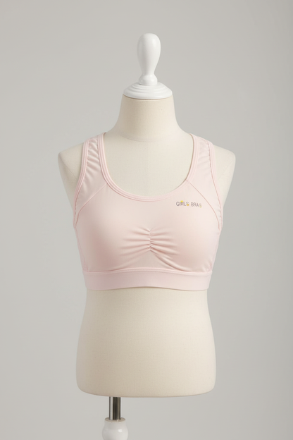 Light pink girls comfort bra displayed on a retail apparel form