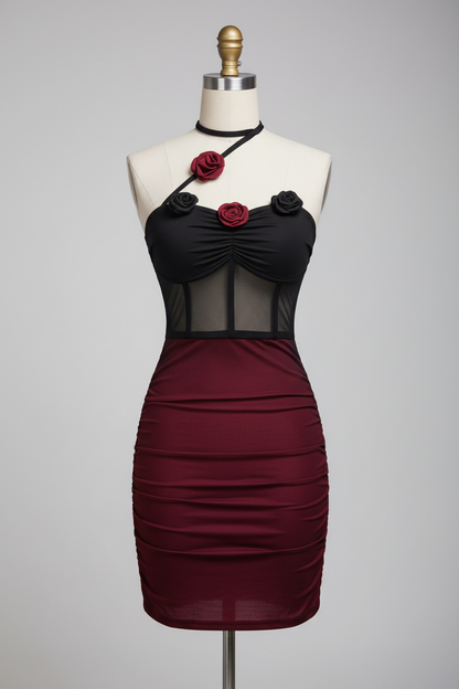 Front view of a black and burgundy rose-detail dress displayed on a covered mannequin